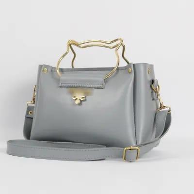 Cat handle cross body bag